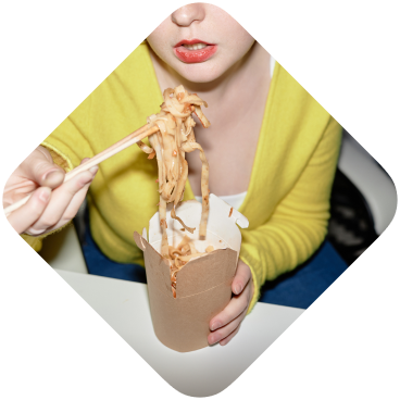 A woman eating noodles